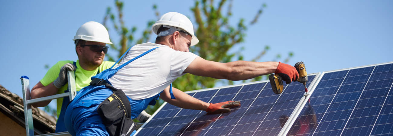 Contractors installing solar panels